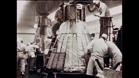 NASA engineers assembling Mercury Program spacecraft capsule Stock Footage 263292225