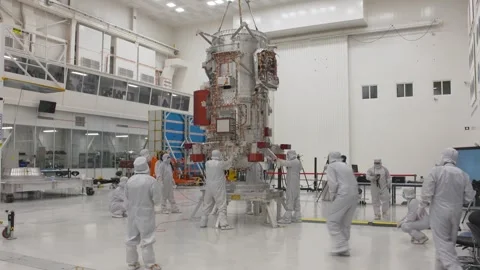 NASA engineers lowering the Europa Clipper spacecraft on to the Elephant stand  Stock Footage 289534464