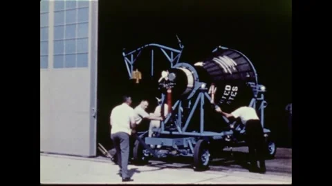 NASA engineers moving Mercury Program spacecraft into hangar Stock Footage 263292206