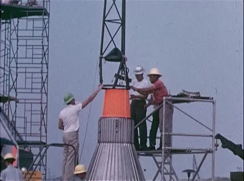 NASA engineers on scaffold platform assemble boosters for Big Joe Atlas Missile Stock Footage 262444793