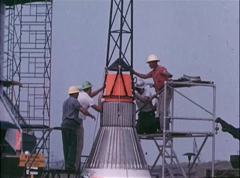 NASA engineers on scaffold platform assemble boosters for Big Joe Atlas Missile Stock Footage 262444795