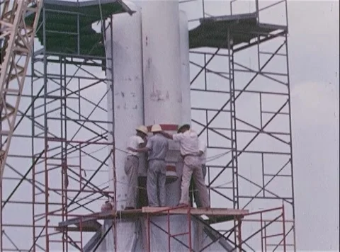 NASA engineers on scaffold platform assemble boosters for Big Joe Atlas Missile Stock Footage 262444832