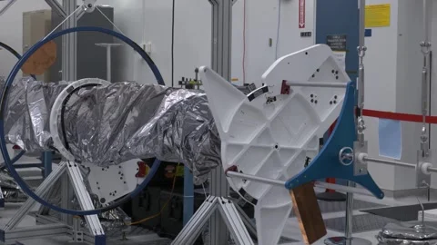 NASA engineers testing Europa Clipper's magnetometer boom in a clean room Stock Footage 289534412