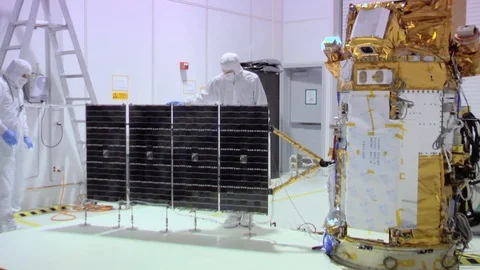 NASA engineers work on deep space solar array in a highly controlled clean room Stock Footage 123370745