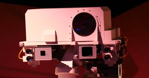 The NASA Mars Curiosity Rover moves across the glowing Martian surface, exp.. Video stock 242052220
