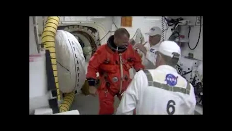 NASA Space Shuttle Atlantis astronaut Pilot Tony Antonelli suiting up Stock Footage 283460540
