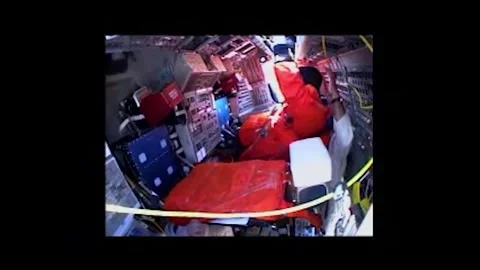 NASA Space Shuttle Atlantis astronaut Commander Ken Ham being seated in cockpit Stock Footage 283460580