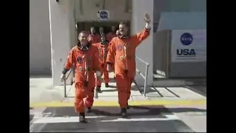 NASA Space Shuttle Atlantis STS-125 astronauts walking out of astronaut quarters Stock Footage 283460499
