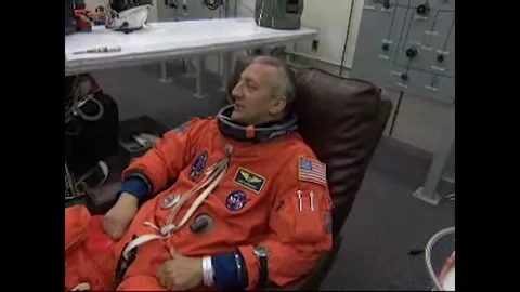 NASA Space Shuttle Atlantis STS-125 Mission Specialist Mike Massimino suiting up Stock Footage 283460512