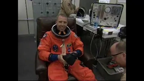 NASA Space Shuttle Atlantis STS-125 Mission Specialist Andrew Feustel suiting up Video stock 283460522