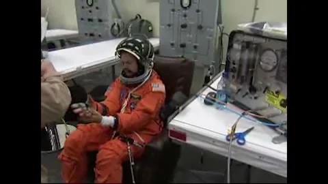 NASA Space Shuttle Atlantis STS-125 astronaut Commander Scott Altman suiting up Stock Footage 283460564