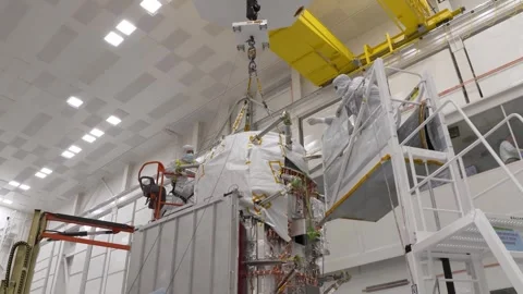 NASA technicians installing Europa Clipper's radiator on to main body Stock Footage 289534422