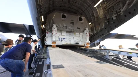 NASA's Europa Clipper spacecraft offloading from C-17 Globemaster aircraft Stock Footage 281840376