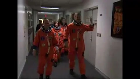 NASA's Space Shuttle Atlantis STS-125 astronauts walking down hallway Stock Footage 283460523
