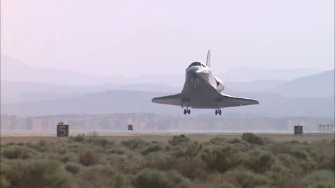 NASA's STS-125 Space Shuttle Atlantis touching down at Edwards Air Force Base Stock Footage 283627524