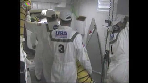 NASA's white room close-out crew securing the door of the Space Shuttle Atlantis Stock Footage 283460434