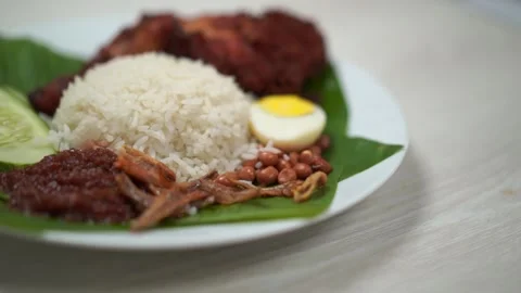 Nasi Lemak dish with chicken drum stick ... | Stock Video | Pond5