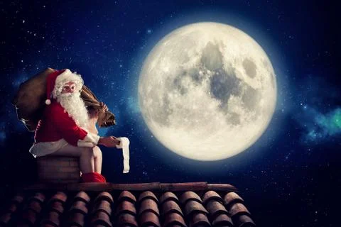 Nasty Santa Claus poop in a chimney under moonlight as bad children gift Stock Photos
