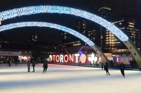 Nathan Phillips Square ice skating Toronto city night Stock Photos