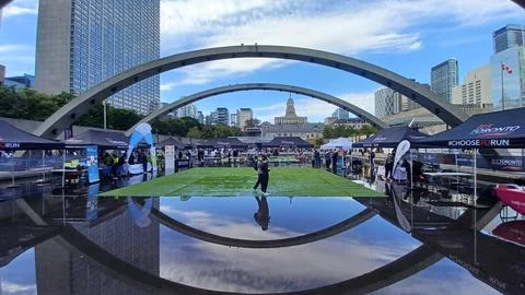 Nathan Phillips Square reflection during marathon Stock Photos