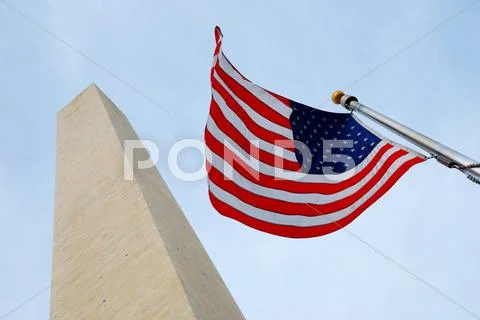 National flag and george washington monument. Stock Photos
