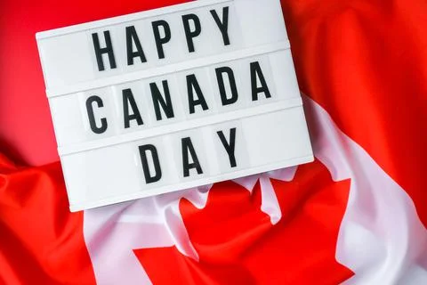The National Flag of Canada. Lightbox with text HAPPY CANADA DAY Canadian Flag Stock Photos