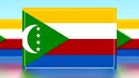 National flag of Comoros with a green triangle white crescent and stars on .. Video stock 343648866