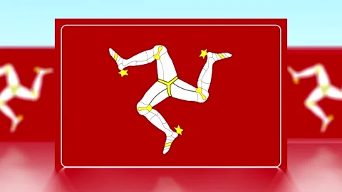 National flag of the Isle of Man featuring the triskelion symbol on a red b.. Video stock 343654515