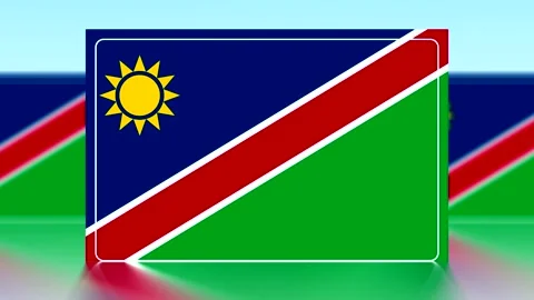 National flag of Namibia featuring a yellow sun on a blue field with diagon.. Stock Footage 343662340