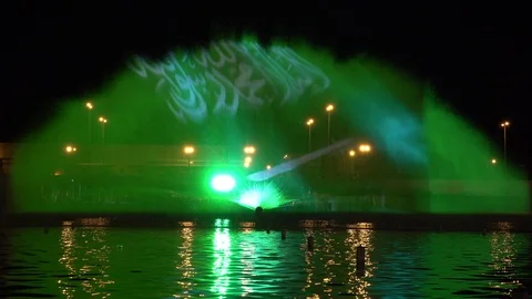 National flag of Saudi Arabia water fountain show at Riyadh night festival Stock Footage