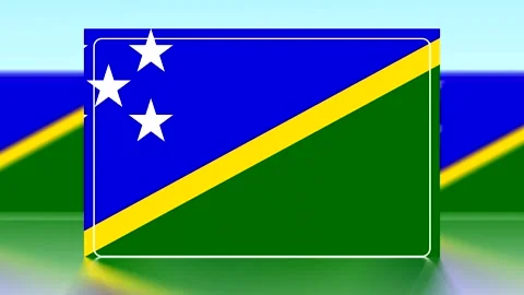 National flag of the Solomon Islands featuring blue green and yellow stripe.. Video stock 343656019