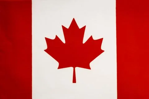 National flag of the state of Canada close-up. State background. Stock Photos