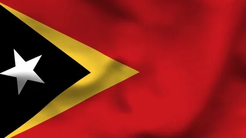 National flag of Timor-Leste on wavy textile. Features a red field with overl Stock-Footage 335161322