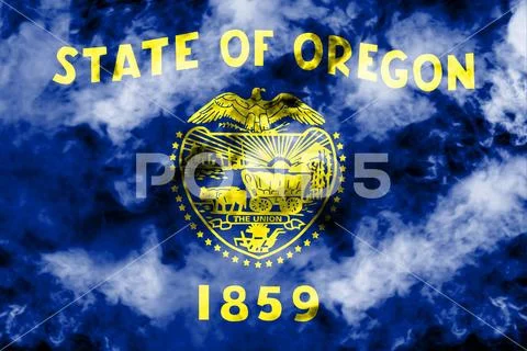 The national flag of the US state Oregon in against a gray smoke on the day o Stock Photos