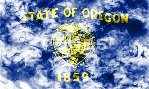 The national flag of the US state Oregon in against a gray smoke on the day o Stock Photos