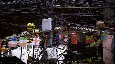 National Flags Behind Electrical Wire Cable Tangled and Chaos at Thamel Street Stock Footage 94718128