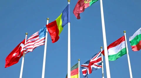 National flags of various countries  against a blue sky Stock Footage 37123068
