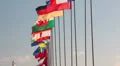 National flags waving on flagpole on blue sky background. Cyprus coastline HD Footage