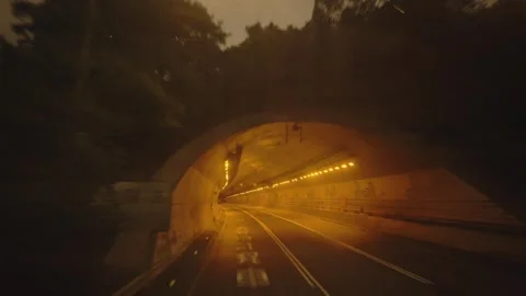 National Freeway 5 at Dawn with Vehicles Entering a Tunnel in Taiwan Stock Footage 341860796