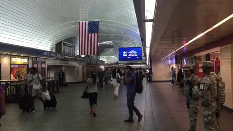 National Guard troops have been stationed at New York Penn Station mass transit Stock Footage 70175271