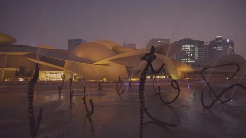 National museum of Qatar (Desert rose) exterior night  shot in summer Stock Footage 135358564