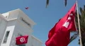 National red flag of Tunisia over blue sky. Close-up view HD Footage
