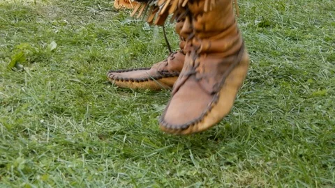 Native American In Cow Hide Leather Moccasins Dancing On Grass Stock Footage 121209898