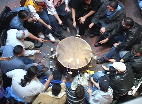 Native American dance &amp; drums 5, big drum circle loud beats elevated view Stock Footage 296716253