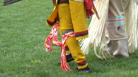 Native American dancers step in time with the Pow Wow drum beats. Stock Footage 312251773