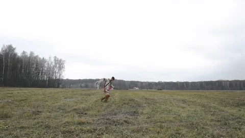 Native American dancing, running across the field Stock Footage 124210979