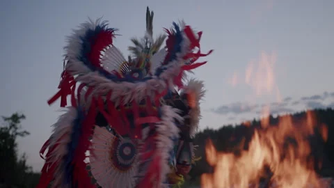Native American Indigenous Dancing by the fireplace at sunset in Alberta Canada  Stock Footage 250025133
