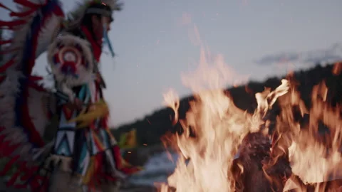 Native American Indigenous Dancing by the fireplace at sunset in Alberta Canada  Stock Footage 250025621