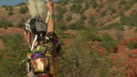 Native American Jingle Dancer with Eagle Feather Fan at Red Rocks Stock Footage 236426384