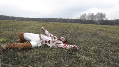 Native American jumps into the field and falls Stock Footage 124211574